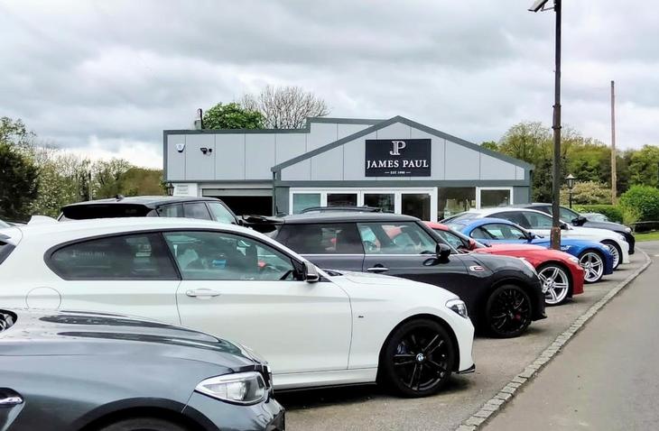James Paul Car Sales front car lot - with a range of BMWs and a Mini prepared and ready for sale